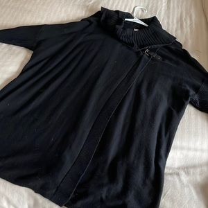 Sweater w/ ribbed sleeves and cowl neck. Opens in front, long for full figures